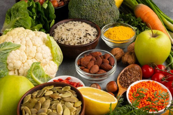 vibrant assortment of fresh vegetables, fruits, grains, and nuts